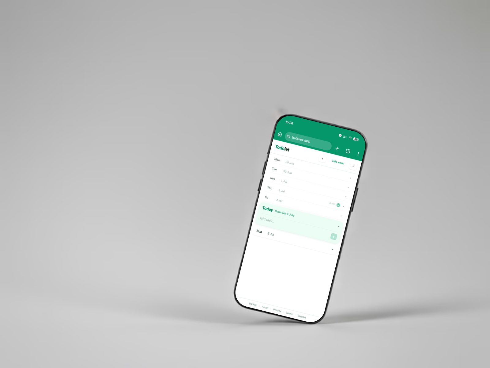 Todolet on a phone, photographed against a plain studio background